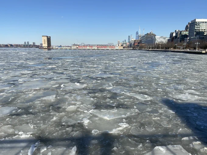 Ice floes create a pebble-like effect on the surface of the Hudson River, as the viewer peers from Pier 26 north, towards Pier 40.