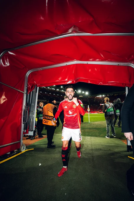 Bruno Fernandes celebrates to the camera in the tunnel.