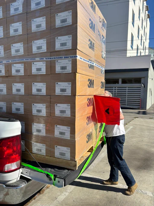 UFW volunteer loading N95 masks onto a truck headed to Ventura County and areas that farm workers are laboring with bad smoky air