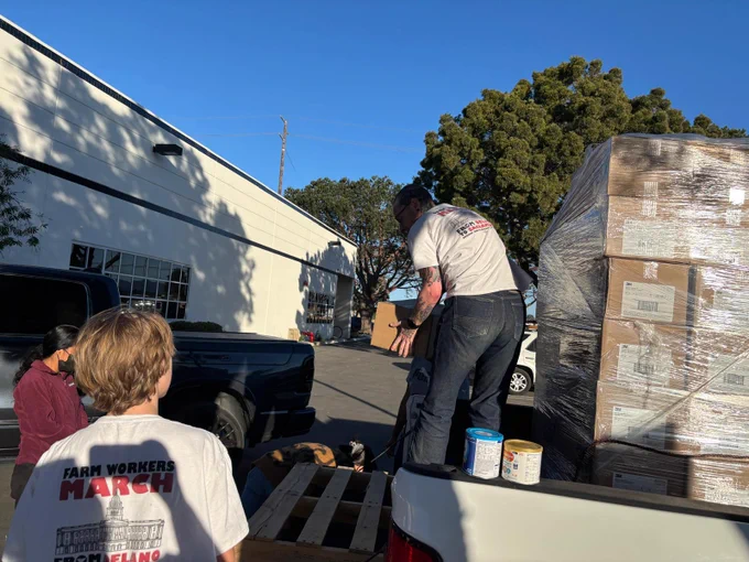 UFW volunteer loading N95 masks onto a truck headed to Ventura County and areas that farm workers are laboring with bad smoky air