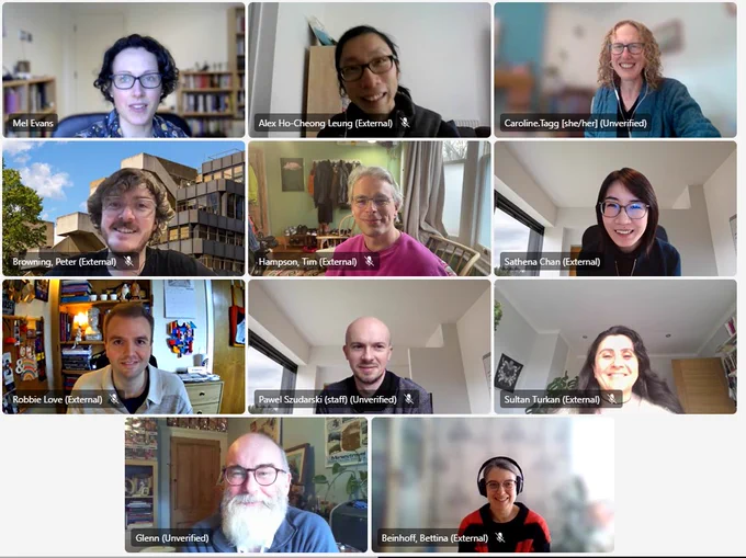 Screenshot of a online meeting with 11 participants smiling at the camera