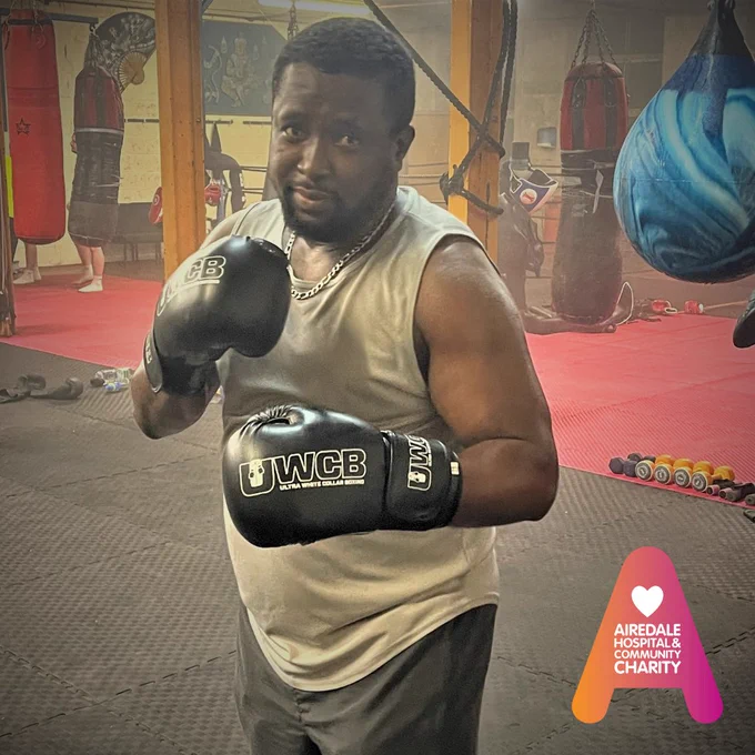 Image of a man posing with boxing gloves 