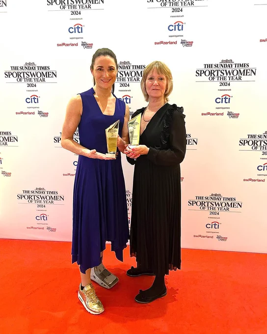 Dame Sarah Storey and Val French pose with their awards on the red carpet