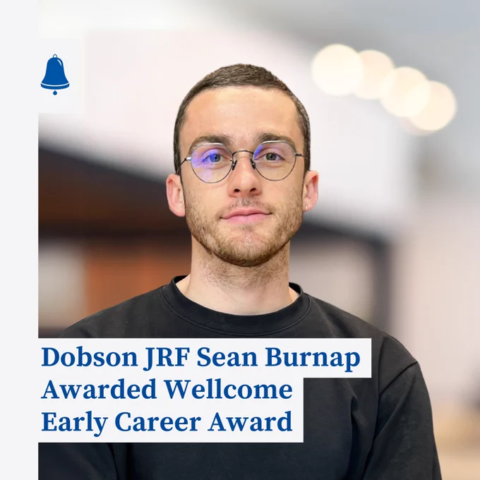 A photograph of Dr Burnap wearing a black t-shirt, looking straight at the camera with a slight smile. Text across the image reads 'Dobson JRF Sean Burnap Awarded Wellcome Early Career Award'.