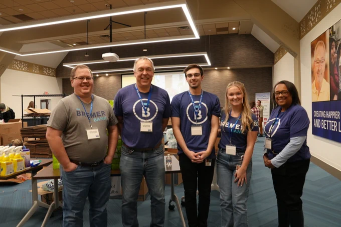 volunteers stand together