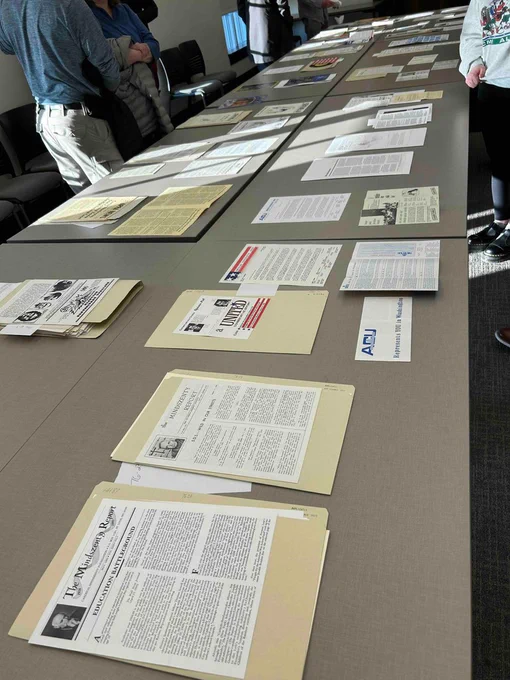 Photo of documents from Hall-Hoag Collection of Dissenting and Extremist Propaganda on a large table