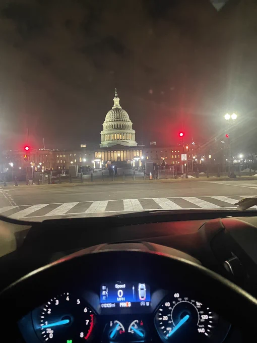 Photo from the drivers seat of a car facing the U.S. Capitol.