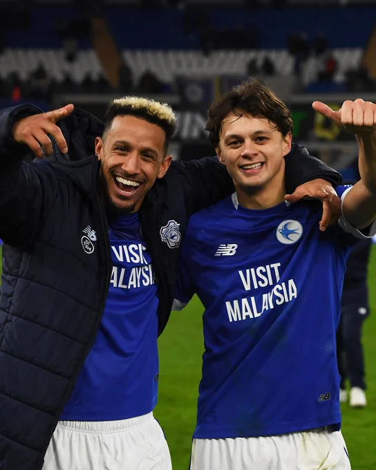 Callum Robinson and Perry Ng celebrate at full-time.