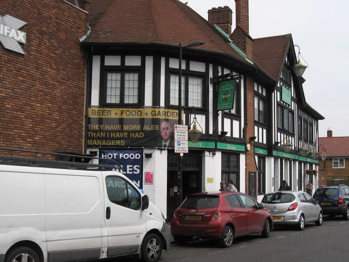 The Beehive pub in Tottenham, with a banner that reads "They have more ales than I have had managers" with a picture of Daniel Levy