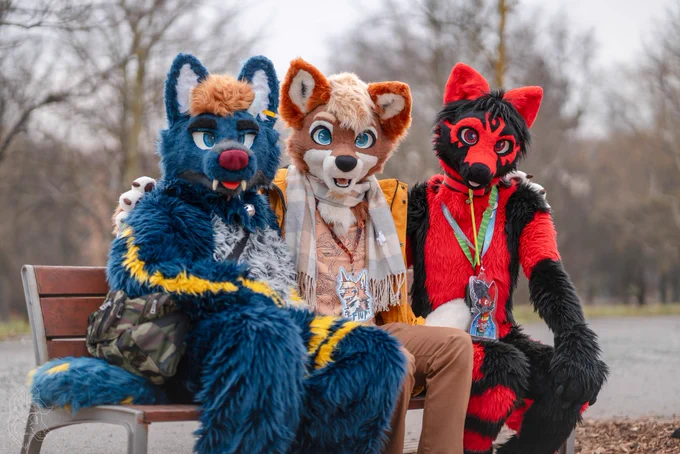 3 Fursuiters sitting on a bench in a park.
From the right: Ican, Flup and me