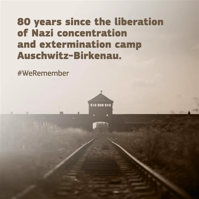 An image of the railway tracks leading to the main gate of Auschwitz-Birkenau, the Nazi concentration and extermination camp. The text reads, "80 years since the liberation of Nazi concentration and extermination camp Auschwitz-Birkenau." Below is the hashtag #WeRemember. 