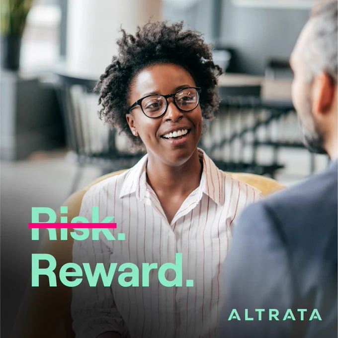 Woman smiles during conversation. The word "risk" is crossed out and the word "reward" is right below it.