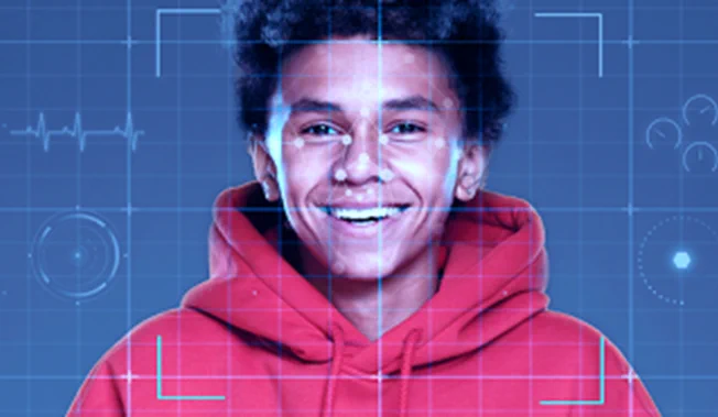 Photo of a person's face with data scanning graphics overlaid.
