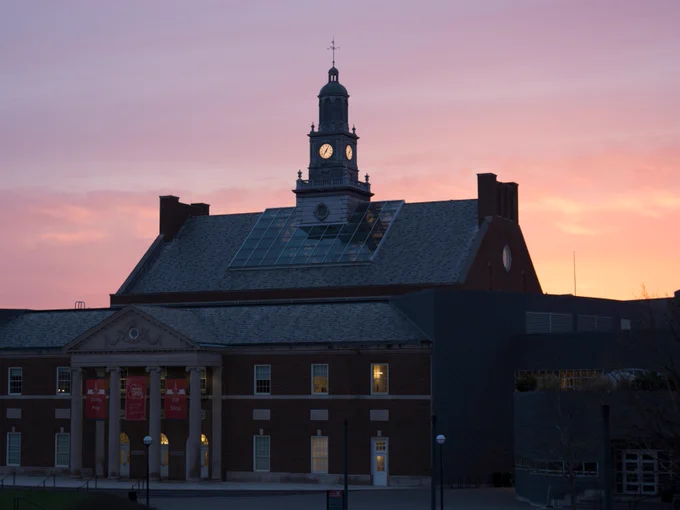 Sunrise view of TUC with a vibrant sky in the background.
