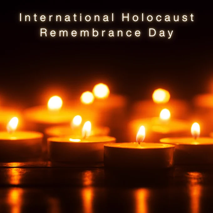 International Holocaust Remembrance Day with candles shining in the dark