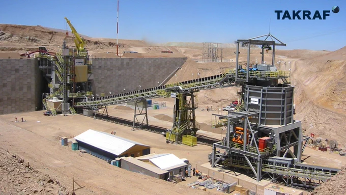 From left to right: TAKRAF Primary Crushing Station and Discharge Conveyor to transport the crushed material to a TAKRAF Transfer Silo equipped with a belt feeder.