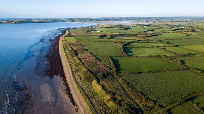 Image of coast of ireland with sea on left and land on right