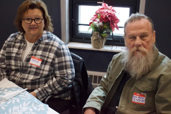 An older man and woman pose for a picture.