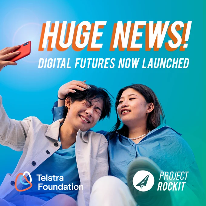 [ID A blue-green gradient tile with bold white text reading "Huge News! Digital Futures Now Launched". Two Asian young people posing to take a selfie in co-ordinated blue and beige outfits. Telstra Foundation and PROJECT ROCKIT logos sit in the bottom corners.]