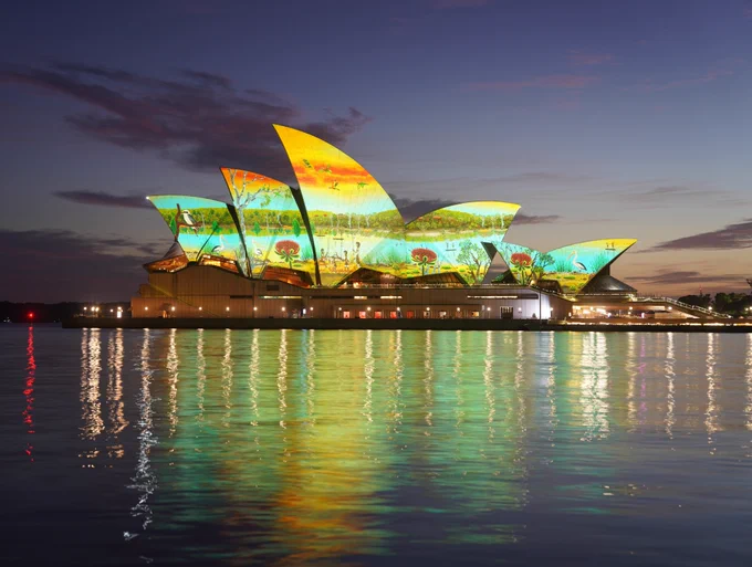 The sails of the Sydney Opera House were lit up to celebrate Australia Day early on the morning of January 26, 2025 with  an artwork titled River Life by indigenous artist James P Simon. TWT On-the-Spot PHOTO (Michelle Haywood)
