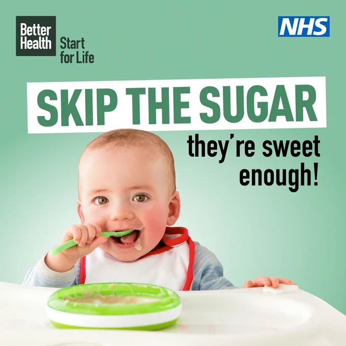 A baby in a high chair with a spoon in their mouth with the caption "Skip the sugar they're sweet enough"
