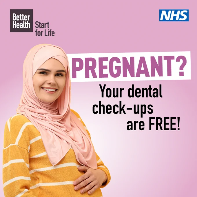 A smiling pregnant woman with her hand placed on her baby bump with the caption "Pregnant? Your dental check-ups are free!".