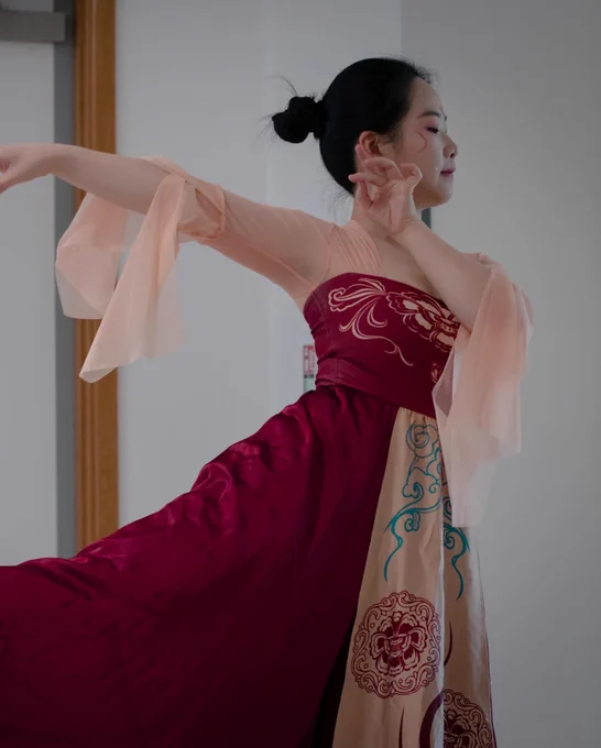 A performer wearing a red dress dances as part of the Lunar New Year celebrations at Sheffield Children’s