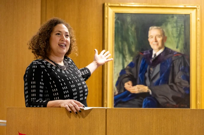 Charissa Jefferson with the portrait of J. Douglass Brown.
