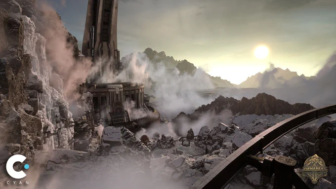 A crisp screenshot of an unearthly craggy landscape enveloped in ground fog, from the PS5 version of Firmament a game by Cyan Worlds. A sun hovers over the horizon in a misty gray sky, and an ornate industrial building is tucked into the hillside of a mountain.