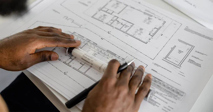 Blue prints on a table.