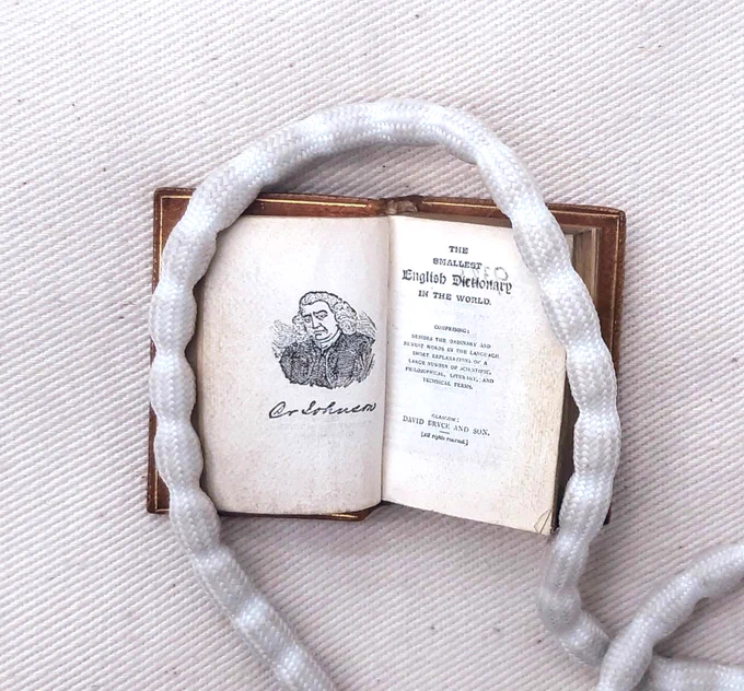 The Smallest Dictionary in the World - about the size of a new postage stamp. Shows a picture on the left of Dr Johnson - who wrote the first - and the title page. Published 1893.
