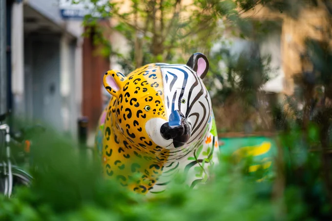 A statue of a bear painted in different colours as part of a bear hunt in southport. 