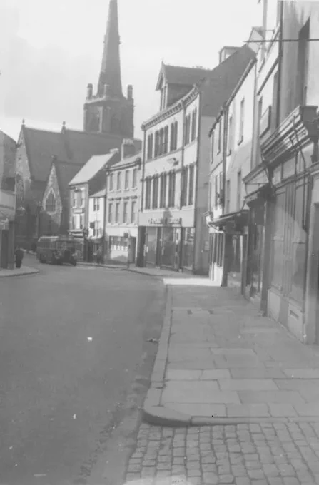 Shops and Businesses at the Bottom of Claypath, Durham, showing old 18th and 19th century buildings now demolished. 