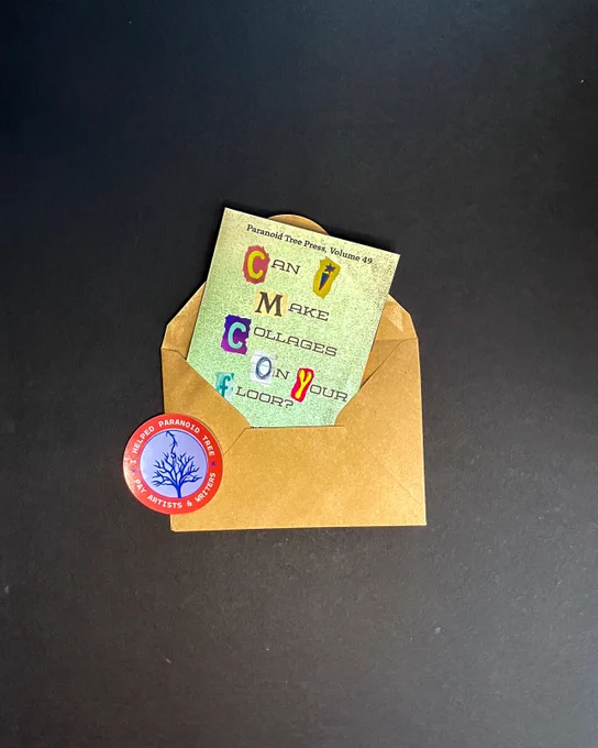 A folded-up copy of the zine, tucked into an envelope next to a Paranoid Tree sticker.
