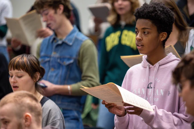 University Singers warming up for class