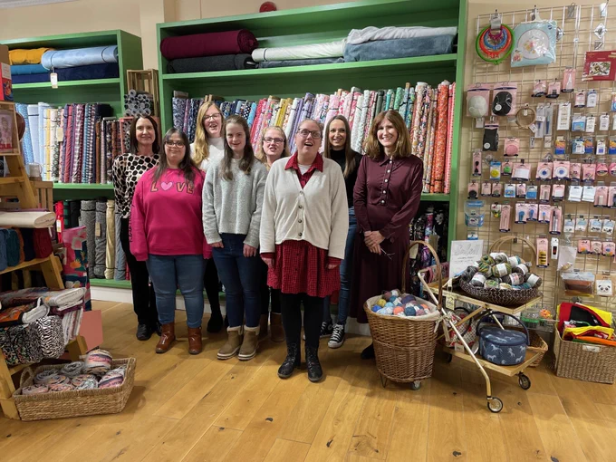 Photo of work experience group based in a fabric and knitting shop.
