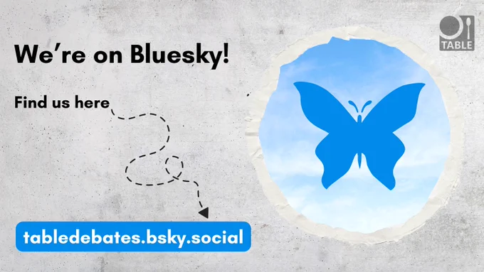 A concrete wall with a bit of sky and the Bluesky butterfly logo and the text "We're on Bluesky! Find us here: tabledebates.bsky.social"