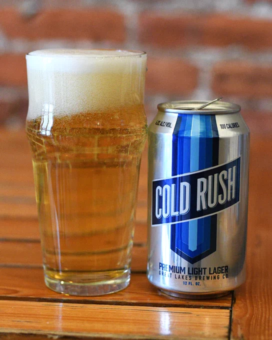 Can of Cold Rush Premium Light Lager by Great Lakes next to a poured pint glass.