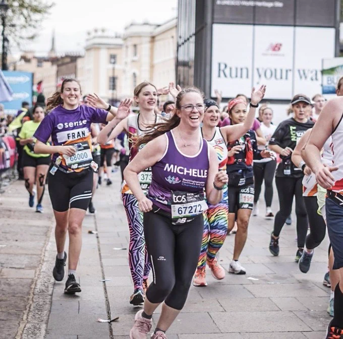 Michelle running the London Marathon in 2024 wearing our charity marathon vest.