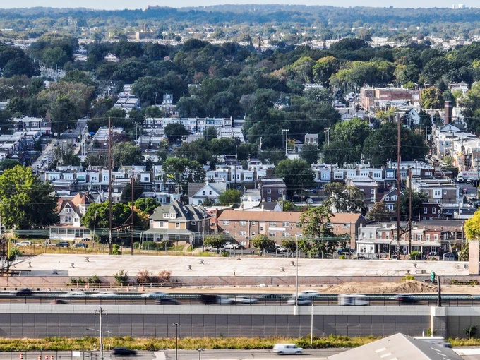 an aerial view of a small town in PA. a highway is in the foreground