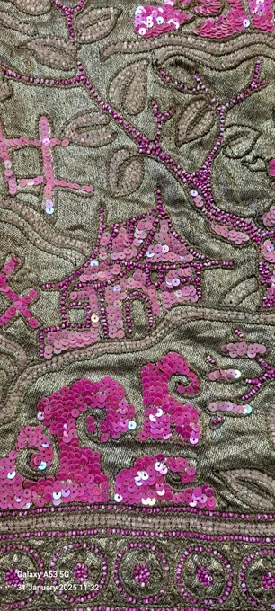 A Chines building depicted in shining pink sequins stitched onto a gold background, detail of an evening coat, 1920s