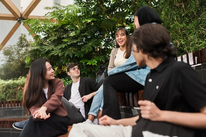 Group of students having fun at a park. Credit: James Tye for UCL.