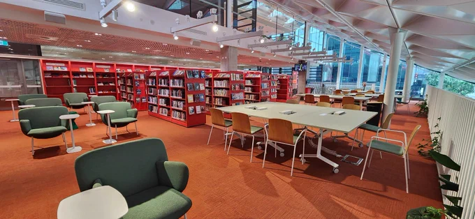 Library seats inspired by eucalyptus green leaves. Library shelves are the colour of the red & orange Waratah flowers. 