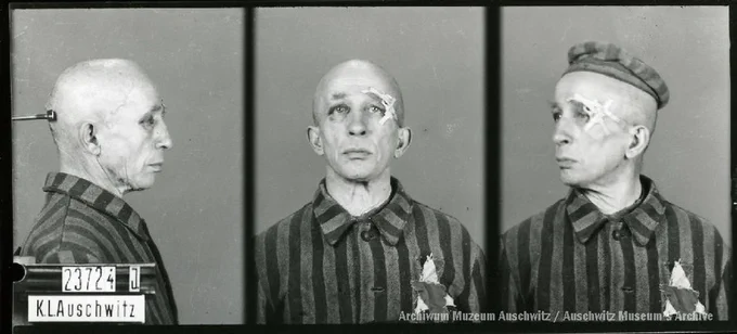 A mugshot registration photograph from Auschwitz. A man with a shaved head wearing a striped uniform photographed in three positions (profile and front with bare head and a photo with a slightly turned head with a hat on). The prisoner number is visible on a marking board on the left.