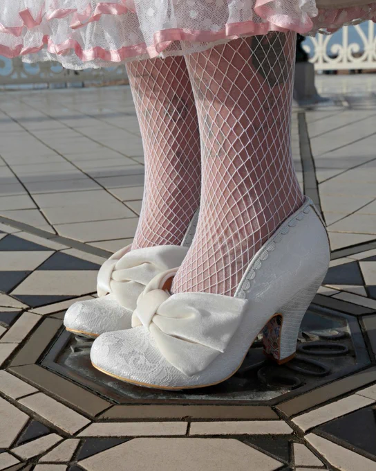 Irregular Choice 'Bow Em Gee' heels. White lace with large velveteen bow.