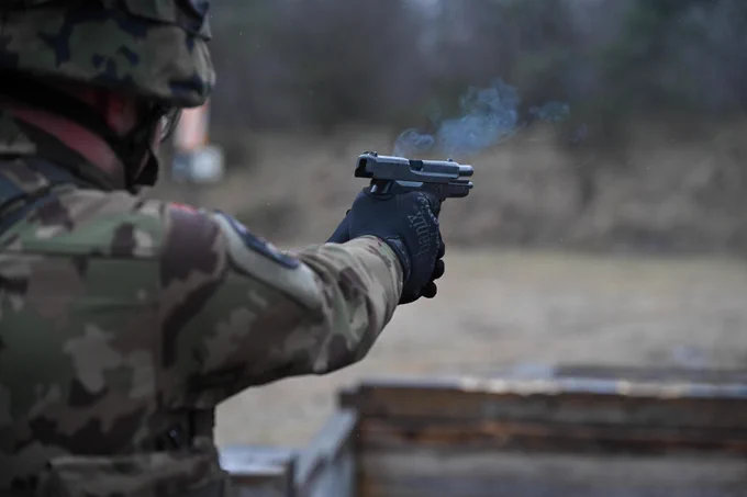 Swiss soldier shooting a pistol