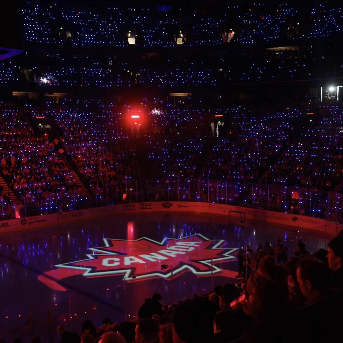 A maple leaf with “Canada” written over it is featured on the ice during a 4 Nations Face-Off game in Montreal, Quebec.