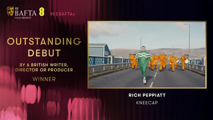Designed graphic with pink fluted background and the text 'Outstanding Debut By A British Writer, Director or Producer Winner' and an image from the film, Kneecap.