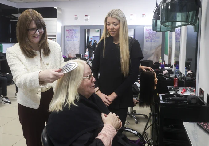 Economy Minister Dr Caoimhe Archibald pictured at Springvale Employment and Learning in Belfast with Springvale hair model Ms Pauline Torney and apprentice hairdresser Grace McVeigh, who is placed at the Hair Lounge in west Belfast.