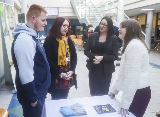 Economy Minister Dr Caoimhe Archibald (right) at Springvale Employment and Learning with Tiernan Devine, Skills for Life and Work learner in computer technology; Nicola Meegan, Disability Action; and Shelly Higgins, Operations Manager, Springvale.
